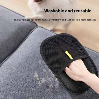 Black grooming glove with yellow handle on a gray surface, used for hair removal.